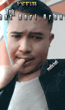 a man with his finger in his mouth and the words " mafiahati " on the bottom right
