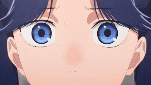 a close up of a girl with blue eyes