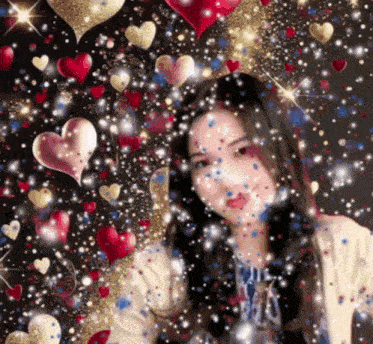 a woman is surrounded by hearts and confetti and has a shirt that says ' i love you ' on it