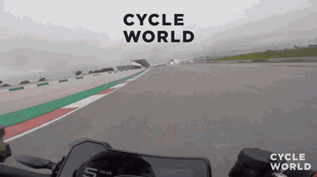 a person riding a motorcycle on a track with cycle world written on the bottom
