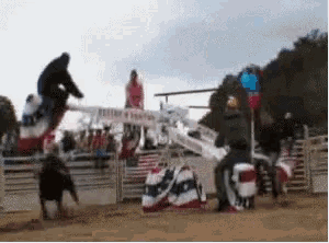 a blurred image of a rodeo with a sign that says ' victory ranch '