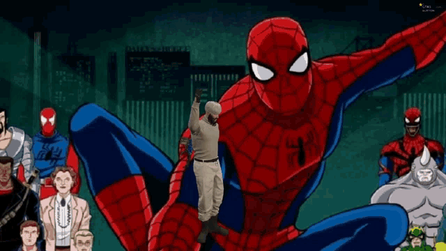 a man stands in front of a spider man surrounded by other spider man characters