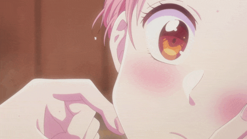 a close up of a person 's face with a tear coming out of her eye