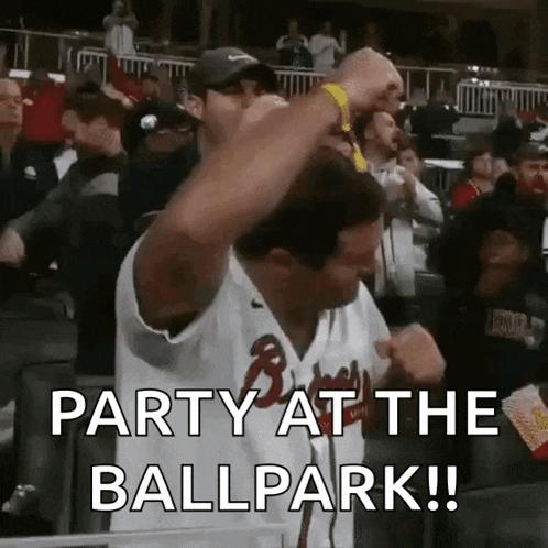 a man in a baseball uniform says party at the ballpark .