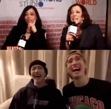 a woman is holding a microphone next to a man who is wearing a chicago sweatshirt .
