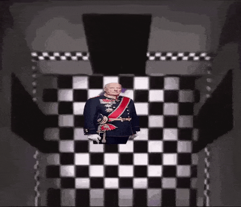 a man in a military uniform is standing in front of a black and white checkered floor .