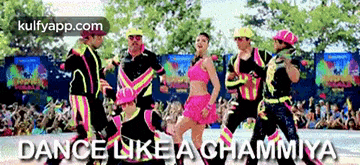 a group of people are dancing in front of a crowd with the words dance like a chammiya below them