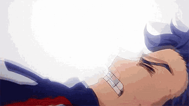 a close up of a person laying on the ground with blood coming out of his mouth .