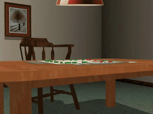 a hand is reaching out from a wooden table