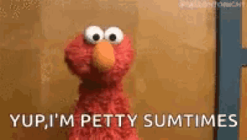 elmo from sesame street is standing in front of a door and says `` yup , i 'm petty sumtimes ''