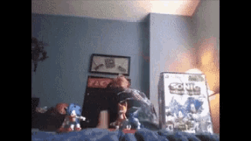 a sonic the hedgehog video game is on a bed