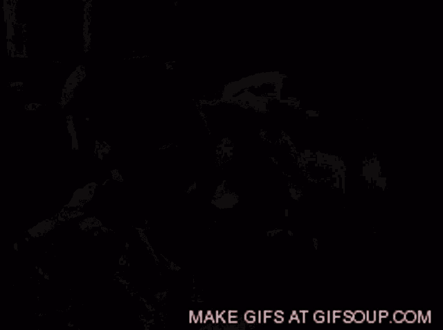 a gif of a man and a woman with the words extra on the bottom