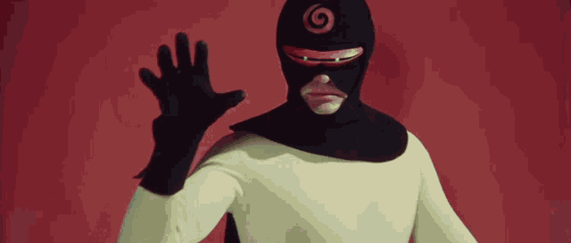 a man wearing a yellow and black superhero costume