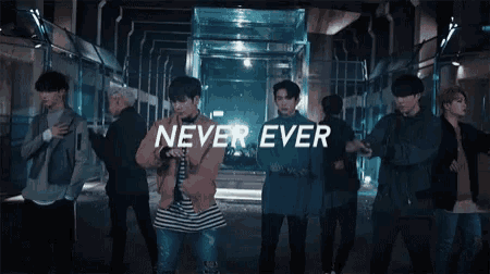 a group of young men are dancing in a video that says `` never ever '' .