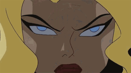 a close up of a woman 's face with blue eyes