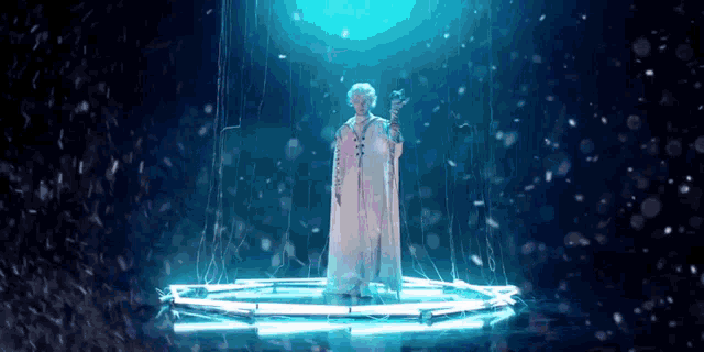 a woman in a white cape is standing in a circle holding a cane .