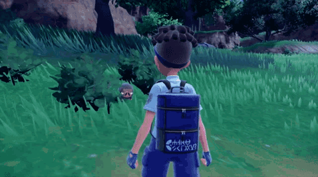 a boy with a blue backpack that says " athlete " on it