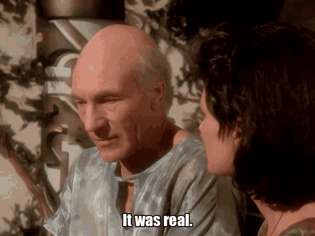 a man and a woman are looking at each other and the woman says it was real