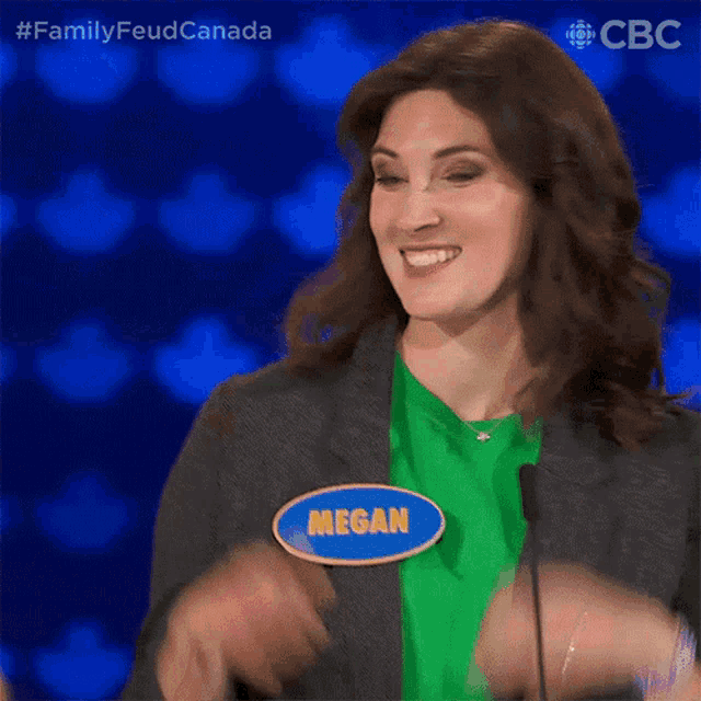 a woman wearing a name tag that says megan on it
