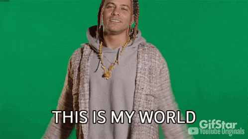 a man with dreadlocks and a necklace says you 're just living in it