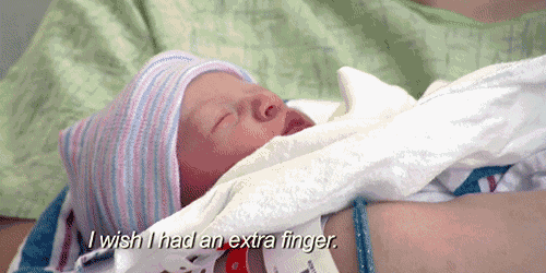 a newborn baby is wrapped in a white blanket with the words " i wish i had an extra finger " above it
