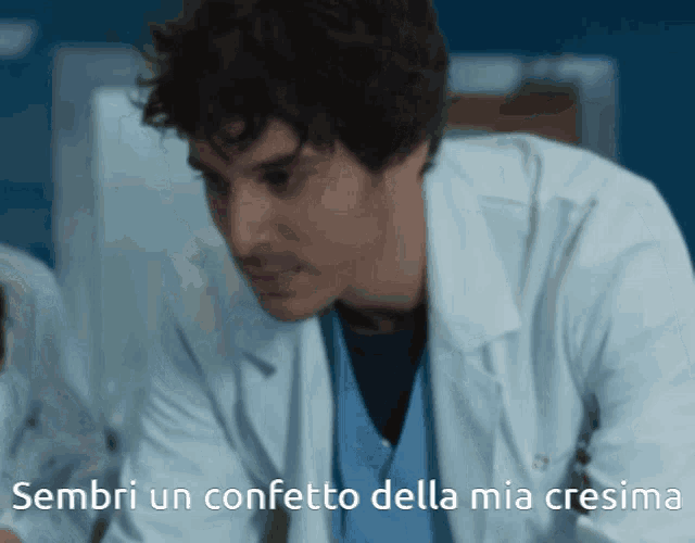 a man in a lab coat with the words sembra un confetto della mia cresima below him