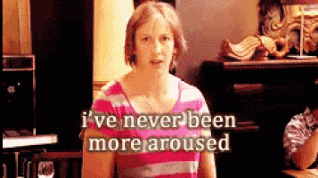 a woman in a pink and white striped shirt says i 've never been more aroused