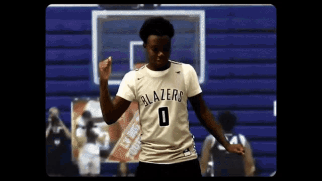 a man wearing a blazers jersey with the number 0