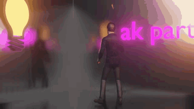 a man is dancing in front of a sign that says " ak part "