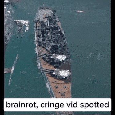 an aerial view of a battleship in the ocean with the words brainrot cringe vid spotted below it