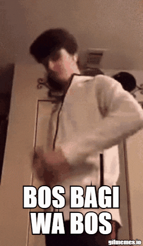 a man in a white shirt is dancing with the words bos bagi wa bos written on the screen