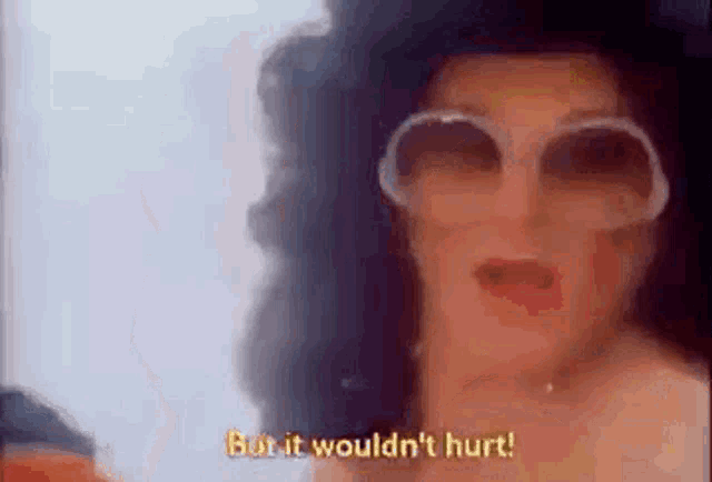 a woman wearing sunglasses and a hat is saying `` but it wouldn 't hurt ! ''