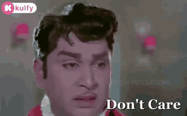 a man is making a funny face and saying don 't care