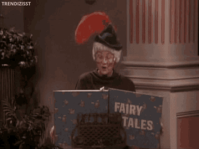 an elderly woman is reading a book titled fairy tales