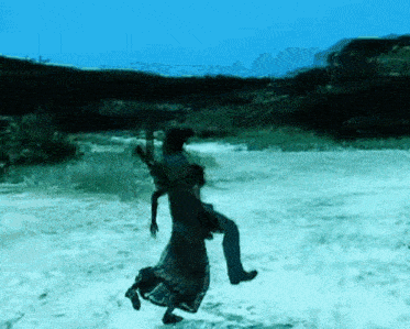 a person is standing in the middle of a snow covered field in a video game .