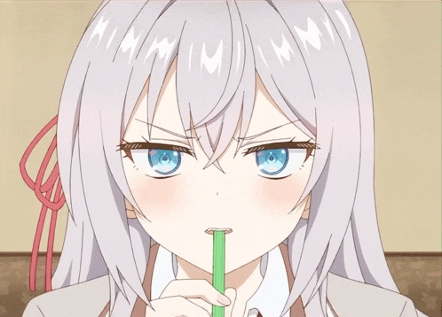 a girl with a green straw in her mouth