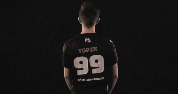 a man in a black shirt with the number 99 on the back