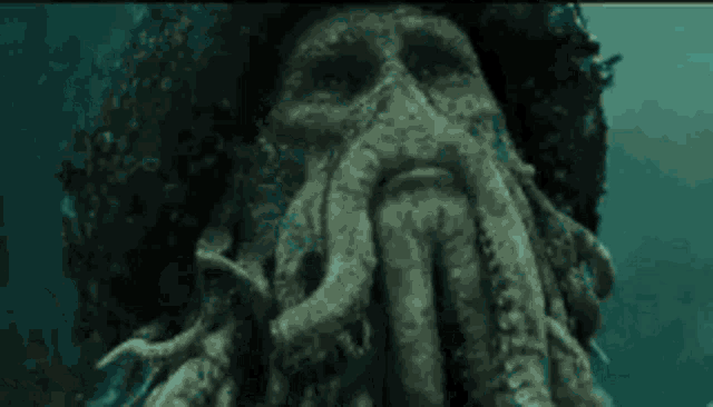 a man with a beard is surrounded by octopus