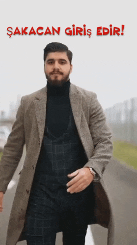 a man in a suit is walking down a street with the words sakacan giriş edr written above him