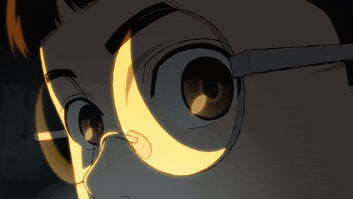 a close up of a person 's eyes with a crescent moon in the middle