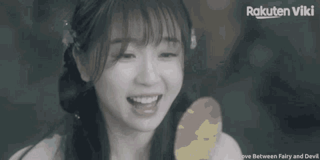 a rakuten viki ad shows a woman laughing