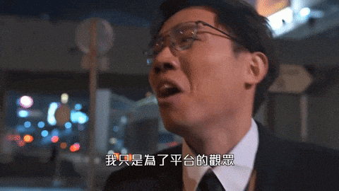 a man wearing glasses and a white shirt has chinese writing on his face