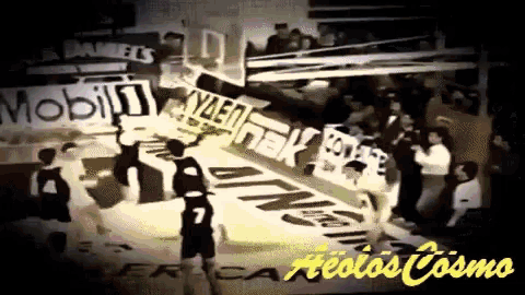a black and white photo of a basketball game with the words aeolos cosmo on the bottom