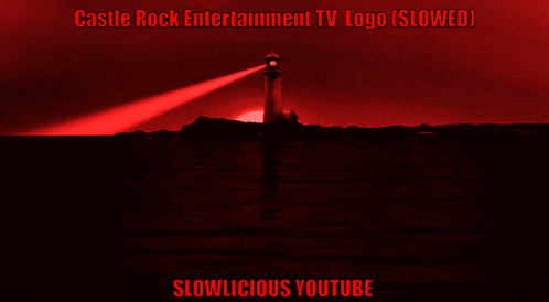 a castle rock entertainment logo with a lighthouse in the water