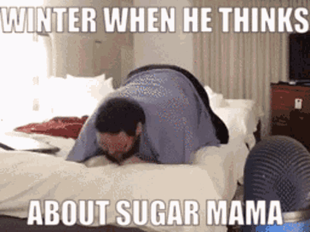 a man laying on his stomach on a bed with a caption that reads winter when he thinks about sugar mama