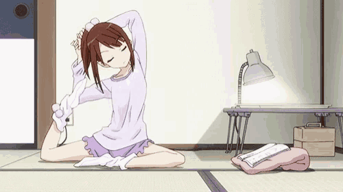 a girl in a purple shirt is stretching her legs