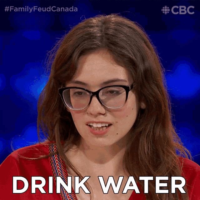 a woman wearing glasses says drink water on a screen