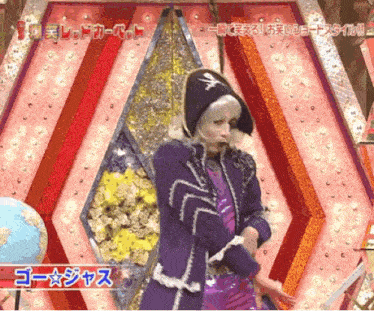 a man in a pirate costume is dancing in front of a sign that says " go "