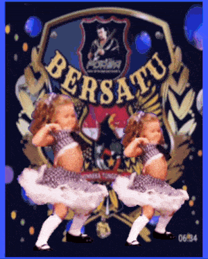 two dolls are dancing in front of a shield that says bersatu