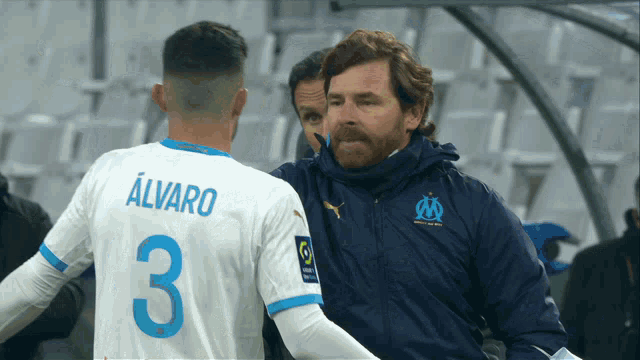 a soccer player with the name alvaro on his shirt